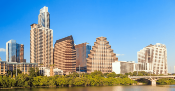 Buildings in downtown Austin Texas with a river in the foreground